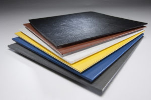 ABS (Acrylonitrile Butadiene Styrene) plastic sheets stacked in assorted colors
