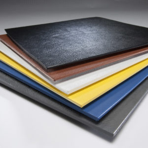 ABS (Acrylonitrile Butadiene Styrene) plastic sheets stacked in assorted colors