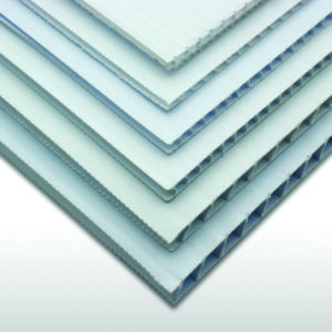 Stack of white corrugated plastic (polypropylene twinwall) sheets