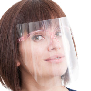 Woman wearing a clear plastic face shield in the workplace