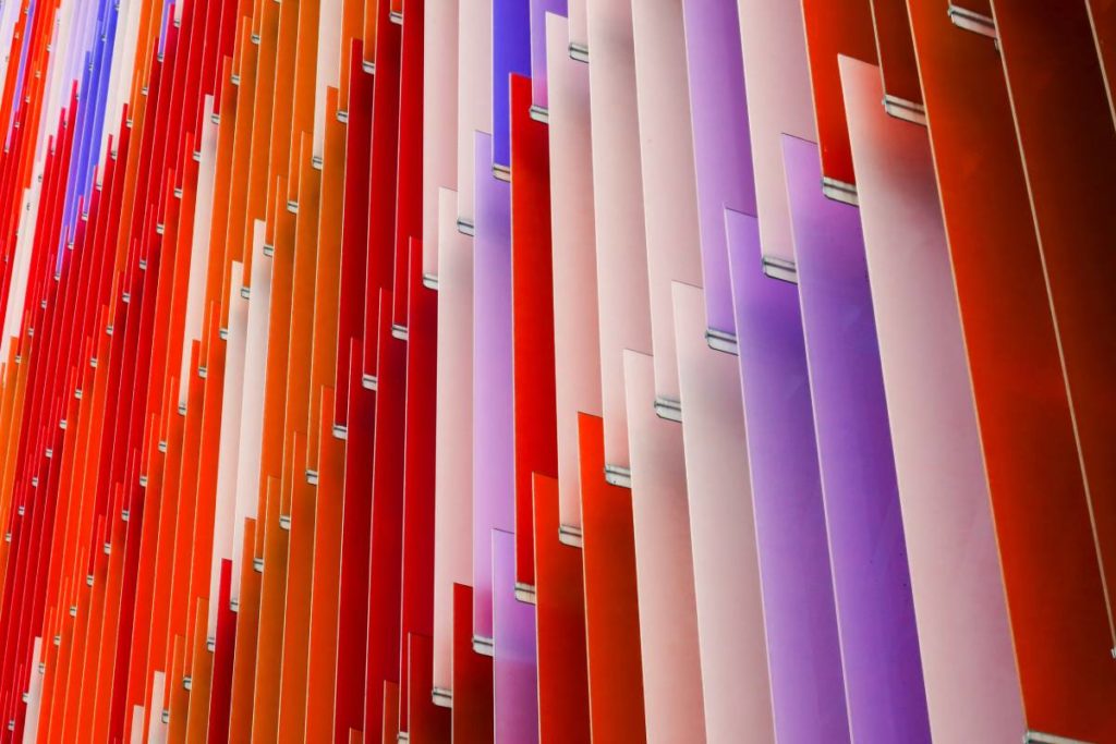 colored acrylic sheets hanging in rows