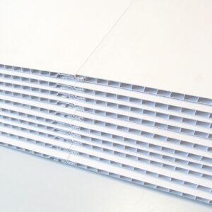 Stack of interlocked white EZLiner PVC Wall Panels